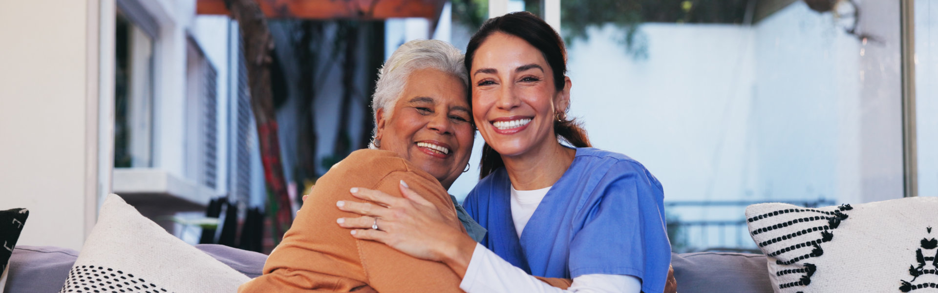 woman and elderly woman smiling