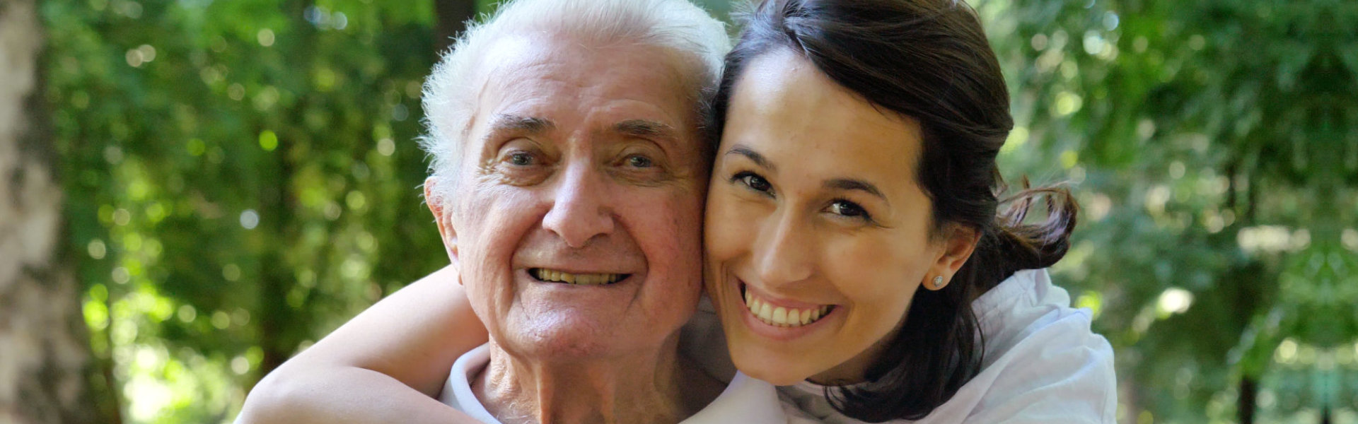 woman and elderly woman smiling