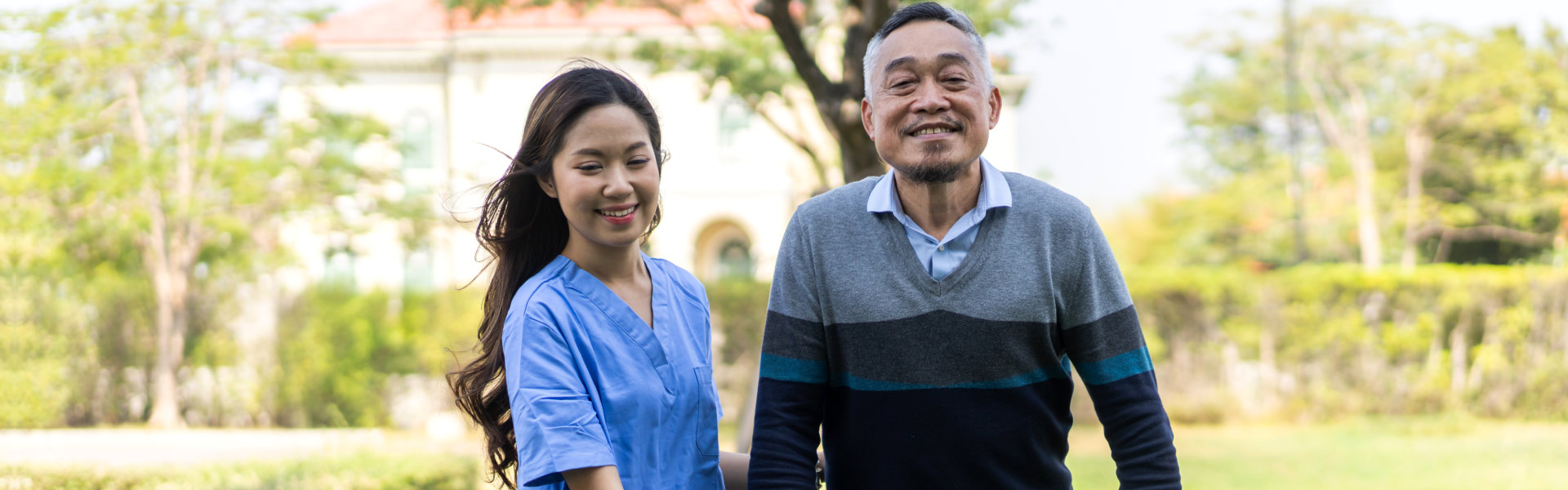 woman and elderly man smiling.