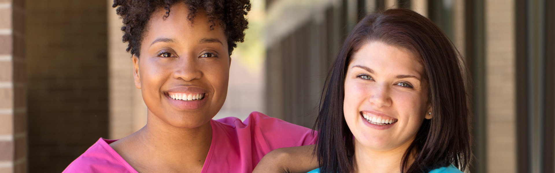 two women smiling.