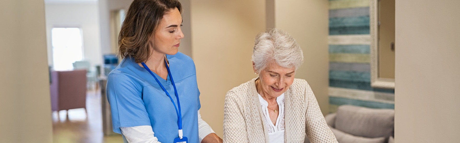 woman assist to an elderly woman.
