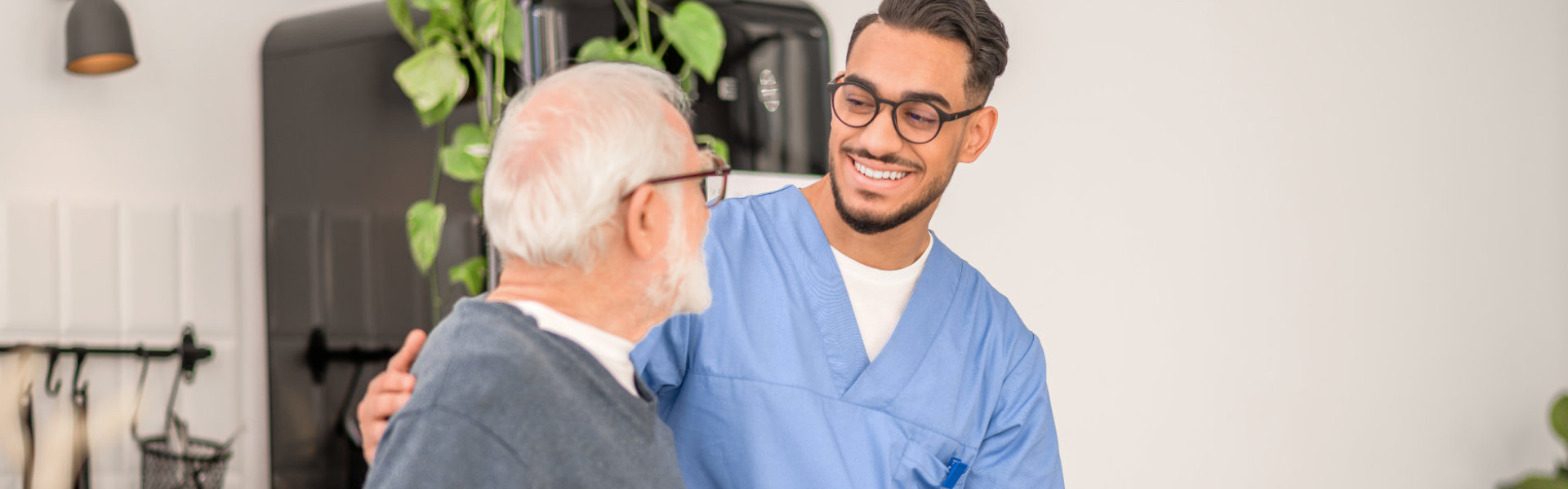 man and elderly man smiling.
